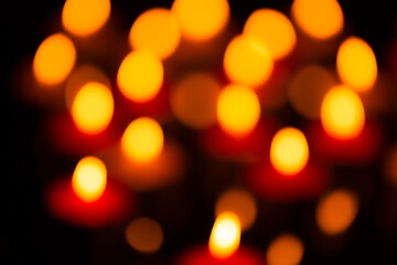 candlelight bokeh light texture,Many candles burn with a shallow depth of field.