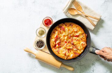 Pizza,Pizza with tomato, mozzarella cheese, arugula and sauce on black stone background web banner menu for restaurant or cafe recipe idea copy space for text 