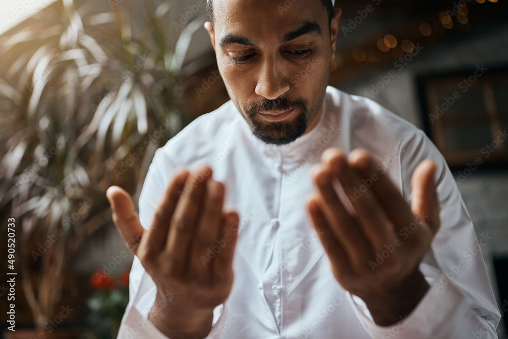 Sticker Close-up of Muslim believer during a prayer at home.