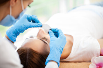 Eyelash Extension Procedure, Professional stylist lengthening female lashes