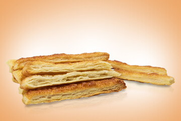 Delicious and sweet puff pastry sticks with cinnamon