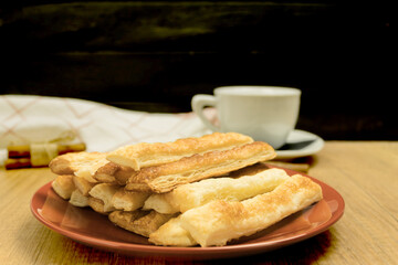 Delicious and sweet puff pastry sticks with cinnamon