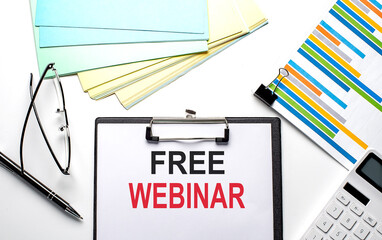 FREE WEBINAR text on the paper sheet with chart,color paper and calculator