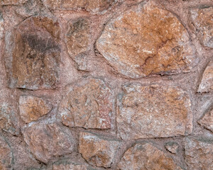 rough aged stone wall closeup
