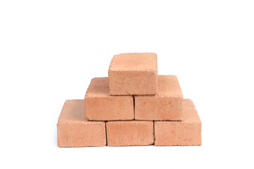 Red bricks isolated on white background. Solid clay bricks used for construction.