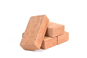 Red bricks isolated on white background. Solid clay bricks used for construction.