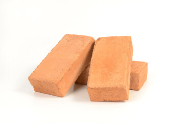 Red bricks isolated on white background. Solid clay bricks used for construction.