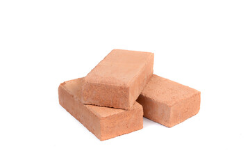 Red bricks isolated on white background. Solid clay bricks used for construction.