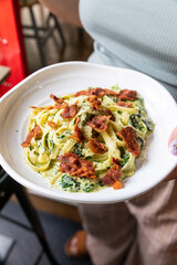 spaghetti carbonara with fried becon