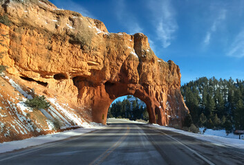 Red stone archway on the road to Bryce Canyon
