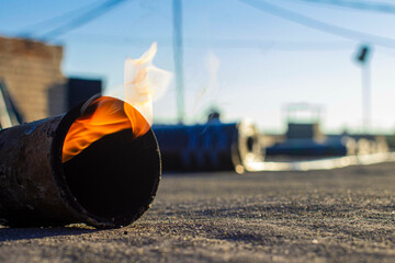 spring repair of a soft roof with rolled materials using a gas burner, the front and background are...