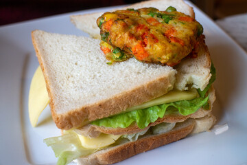 Vegetarian toast with cheese and lettuce on a plate