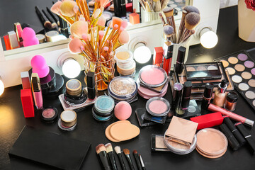 Workplace of makeup artist with different decorative cosmetics, closeup