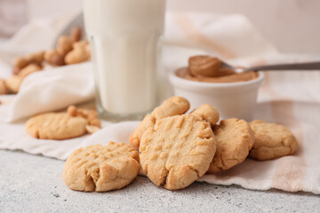 Tasty peanut cookies on light background