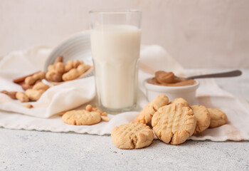 Tasty peanut cookies on light background