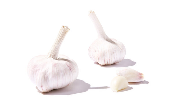 Garlic and garlic cloves on a white background