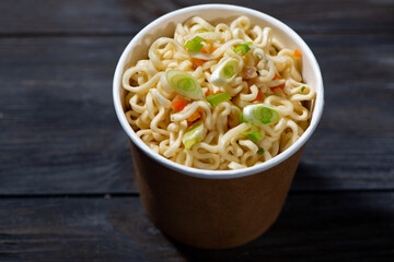 chinese fast food hot noodles in paper cup, top view