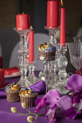 Pink and purple decoration and cupcakes on the table