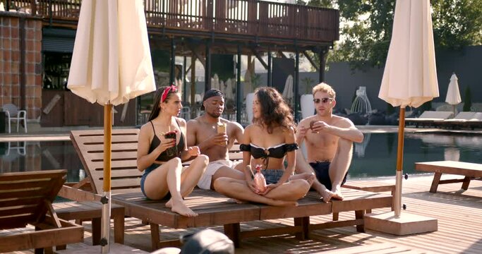 Group of multi ethnic friends having party at summer resort