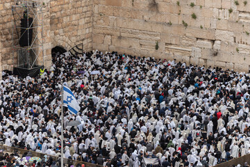 Jewish worshippers crowd into the prayer section below the Western Wall in Jerusalem for the...