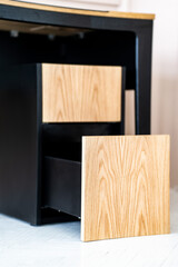 Opened drawer cabinet furniture wooden table at workplace