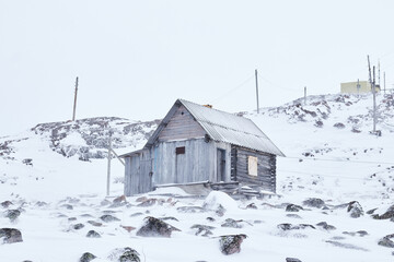 Poverty and devastation problem in russian small towns. Old ruined and abandoned house.