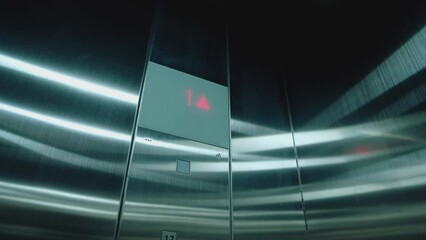 Cabin of modern passenger elevator. Digital lift scoreboard showing floor number. Digital display in the elevator which rises up on floor with an arrow up. Lift go up to the seventh floor. 7st to 1st 