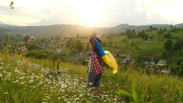 A man with the flag of Ukraine on the background of mountains. Independent of Ukraine.