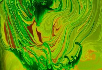 Yellow-green marble background. Acrylic paint flows freely and creates an interesting pattern. Background for the cover of a notebook, laptop, book.
