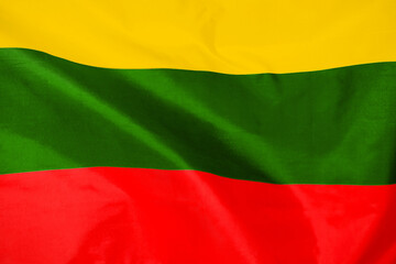 Fabric texture flag of Lithuania. Flag of Lithuania waving in the wind. Lithuania flag is depicted on a sports cloth fabric with many folds. Sport team banner