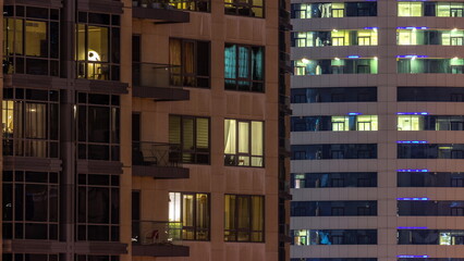 Fototapeta na wymiar Full of the light window in the skyscrapers at night in the modern city timelapse