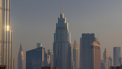 Fototapeta na wymiar Row of the tall buildings around Sheikh Zayed Road and DIFC district aerial timelapse in Dubai