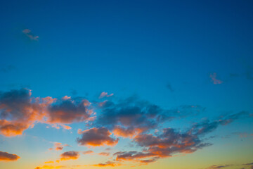 Fototapeta na wymiar Sunset background. Orange clouds and sunset sky.