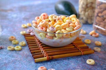 close up of colorful cereal corn flakes in a bowl 