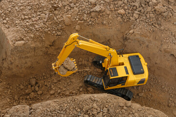 Excavator   are digging canalize the soil in the construction site ,top view
