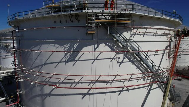 Big industrial oil tanks in a refinery base. industrial plant front view