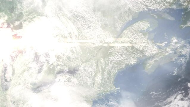 Earth zoom in from outer space to city. Zooming on Terbon, Quebec, Canada. The animation continues by zoom out through clouds and atmosphere into space. Images from NASA