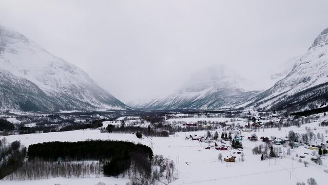 Winter landscape with high snowy mountains. Manndalen Norway. Frozen place. North