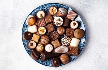 Various chocolate praline candies assortment close up