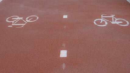 Bicycle sign on asphalt street, Walk ways bike lane with symbol on road, Cycling is a common mode...