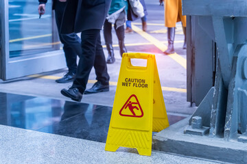 marked with a sign Caution Wet Floor