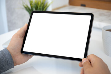 male hands holding computer tablet with isolated screen in office