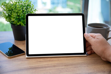 male hands holding computer tablet with isolated screen in office