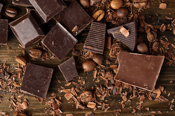 Roasted coffee beans with black chocolate close up