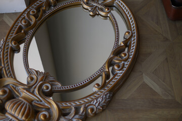 Large round mirror in antique frame