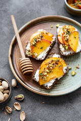 Peach and cream cheese breakfast toast. Peach, ricotta, and hot honey toast. Delicious toast for peak summer