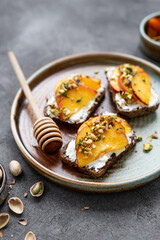 Peach and cream cheese breakfast toast. Peach, ricotta, and hot honey toast. Delicious toast for peak summer