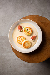 Cottage cheese pancakes with caramel cream sauce and fresh figs ( syrniki )