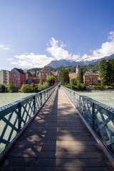 Innsbruck Austria - September 14th 2012: Innsbruck footbridge with alps in background