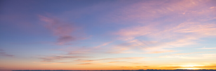 Beautiful Panoramic View of colorful cloudscape with blue Sky in Background during a sunny winter sunset. Taken in Vancouver, British Columbia, Canada.